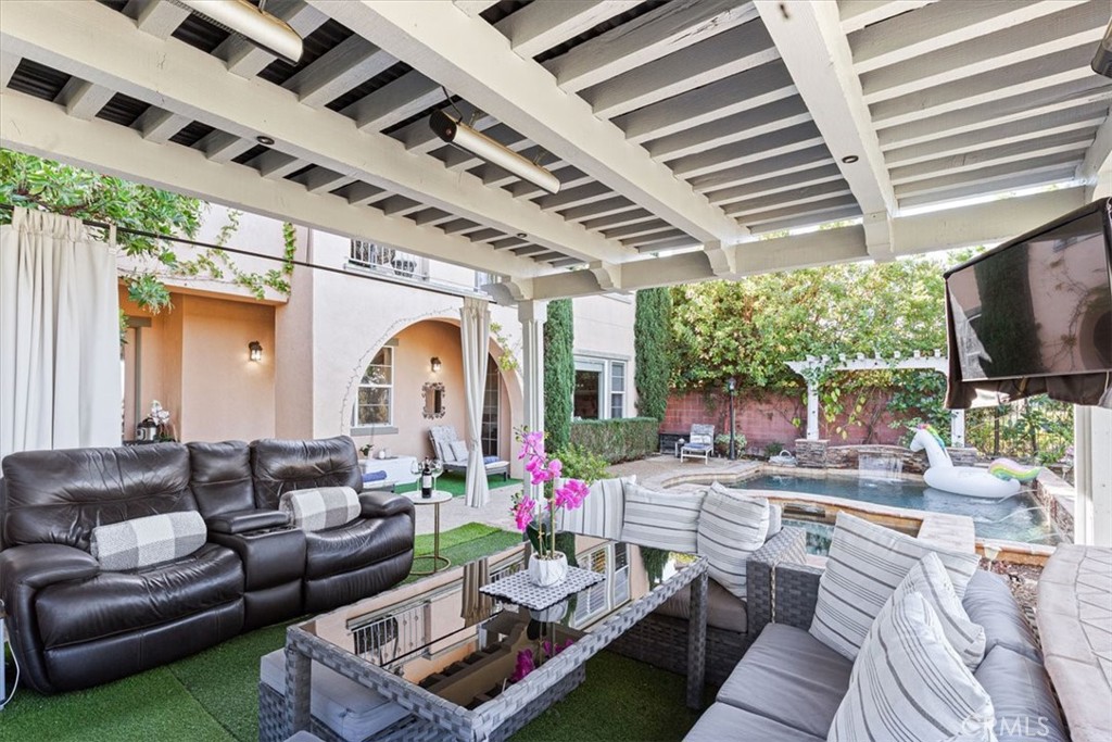 33 Craftsbury Place Ladera Ranch, CA 92694 - Photo 4 of 33 a living room with furniture and a flat screen tv