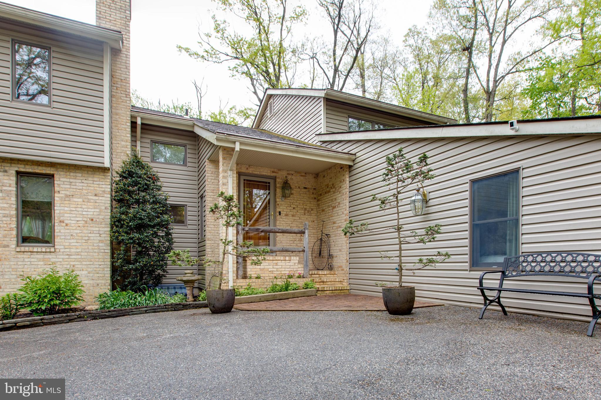 5519 Woodbine Road Sykesville, MD 21784 - Photo 4 of 69 a view of a house with a yard