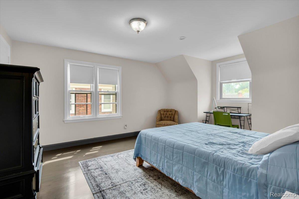 476 Touraine Road Grosse Pointe, MI 48236 - Photo 17 of 30 Hard surface flooring, two windows, vaulted ceiling, and flush mount lighting