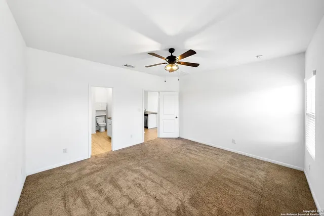 a view of a big room with carpet