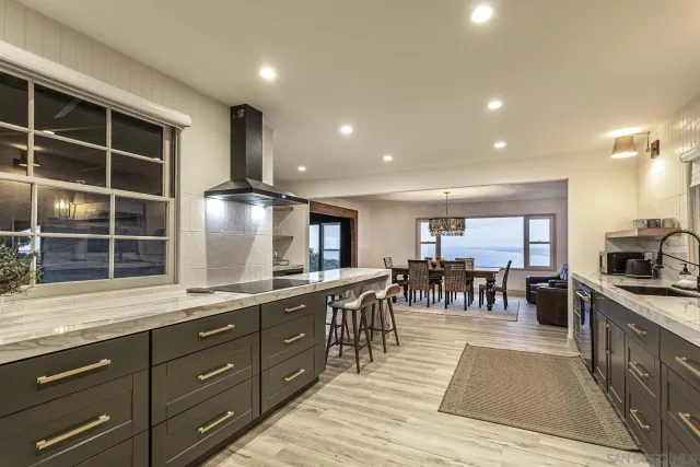 a kitchen with lots of counter top space and living room
