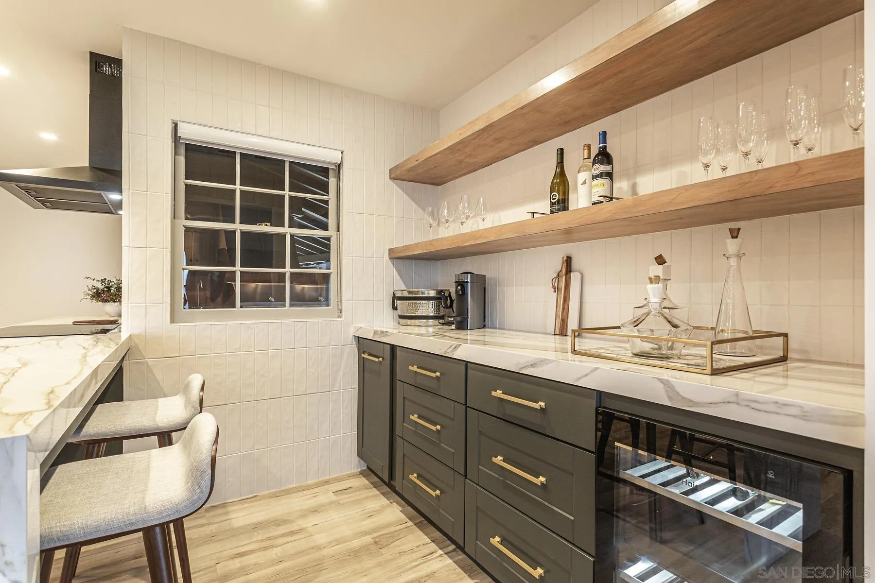 7362 Brodiaea Way La Jolla, CA 92037 - Photo 13 of 31 a kitchen with a sink and cabinets