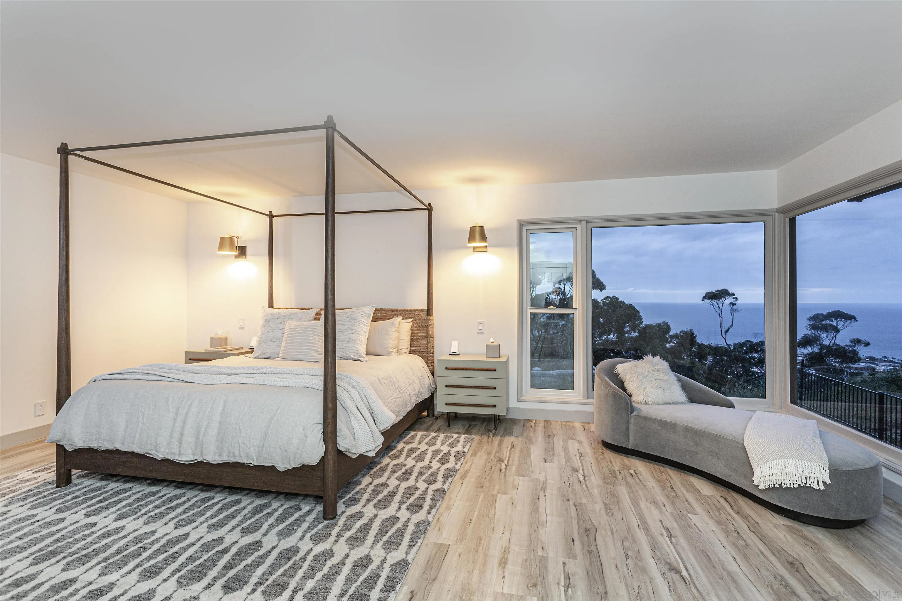 7362 Brodiaea Way La Jolla, CA 92037 - Photo 17 of 31 a spacious bedroom with a bed couch and large window
