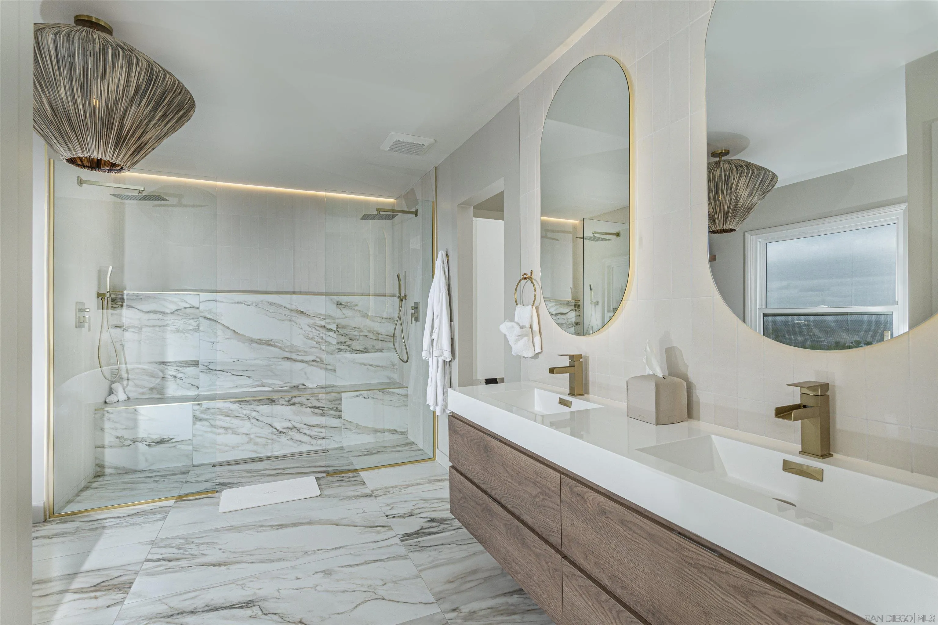 7362 Brodiaea Way La Jolla, CA 92037 - Photo 19 of 31 a bathroom with a double vanity sink mirror and bathtub