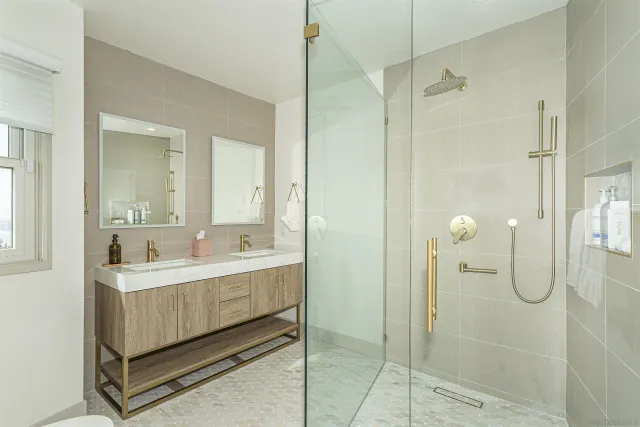 a bedroom with a large bed and a large window