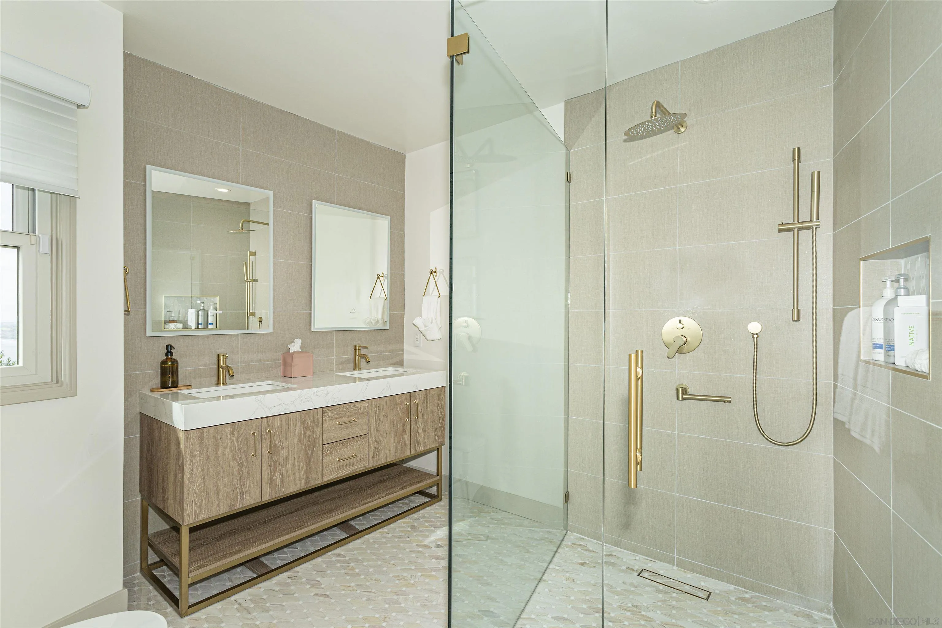 7362 Brodiaea Way La Jolla, CA 92037 - Photo 22 of 31 a bathroom with a double vanity sink mirror and shower