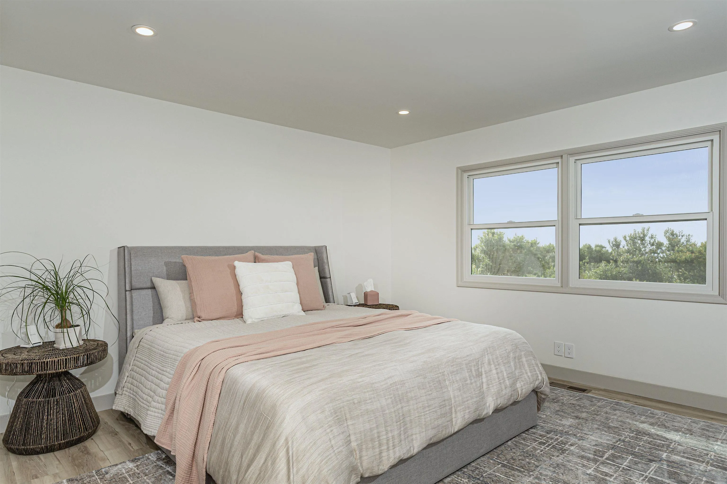 7362 Brodiaea Way La Jolla, CA 92037 - Photo 23 of 31 a bedroom with a large bed and a large window