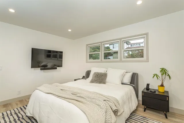a spacious bathroom with a double vanity sink and a mirror
