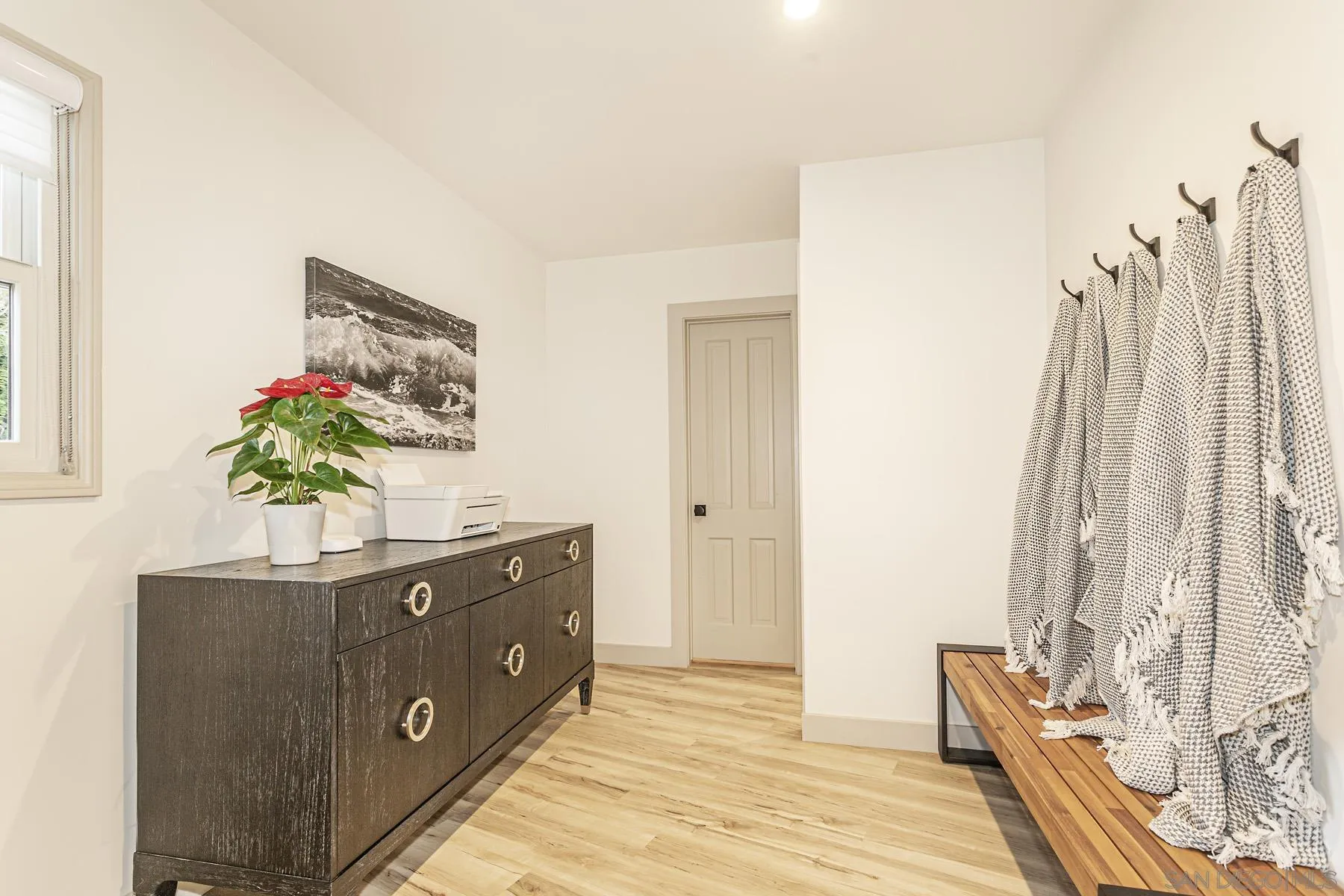 7362 Brodiaea Way La Jolla, CA 92037 - Photo 26 of 31 a spacious bathroom with a double vanity sink and a mirror