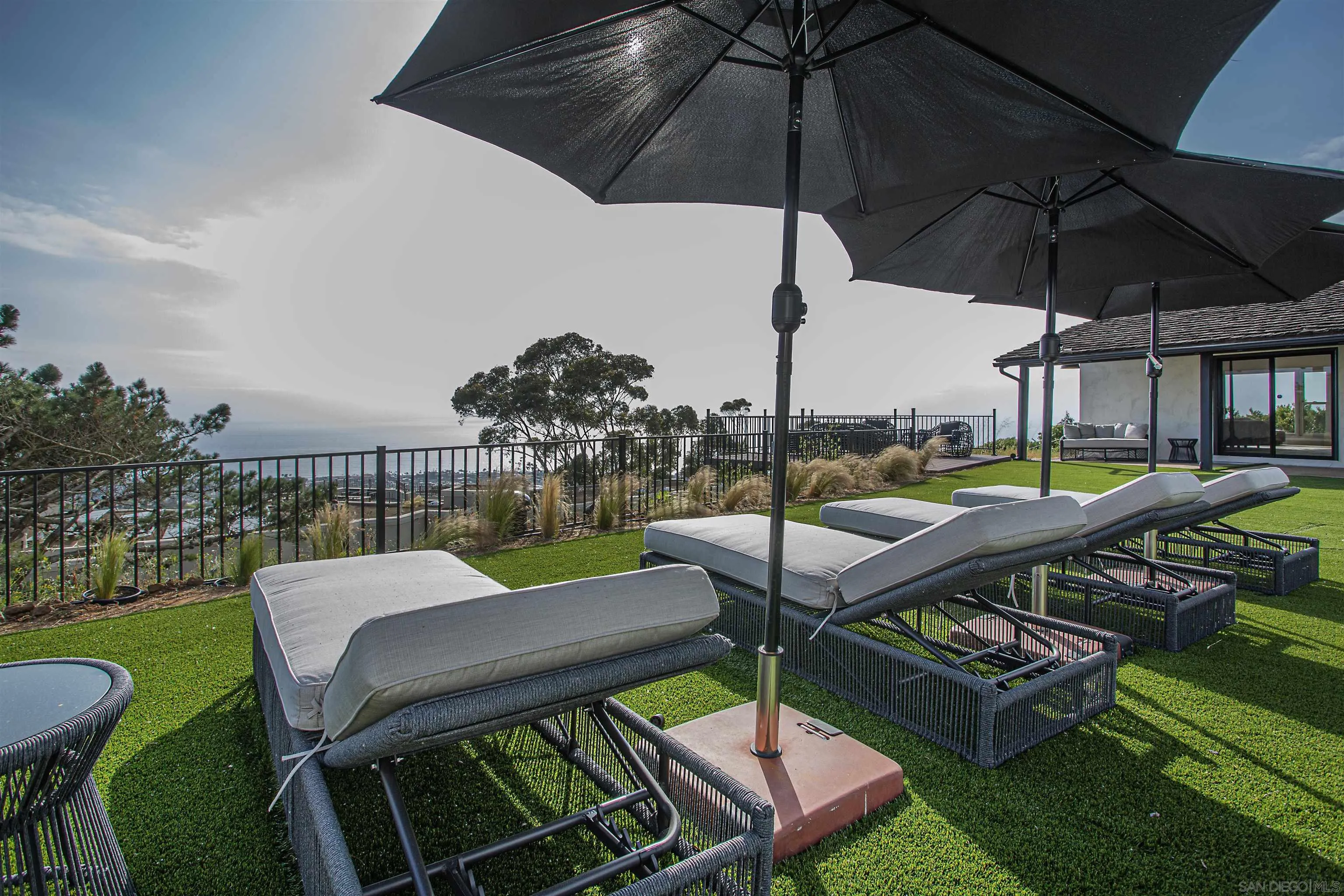 7362 Brodiaea Way La Jolla, CA 92037 - Photo 29 of 31 a view of a patio with chairs and a table