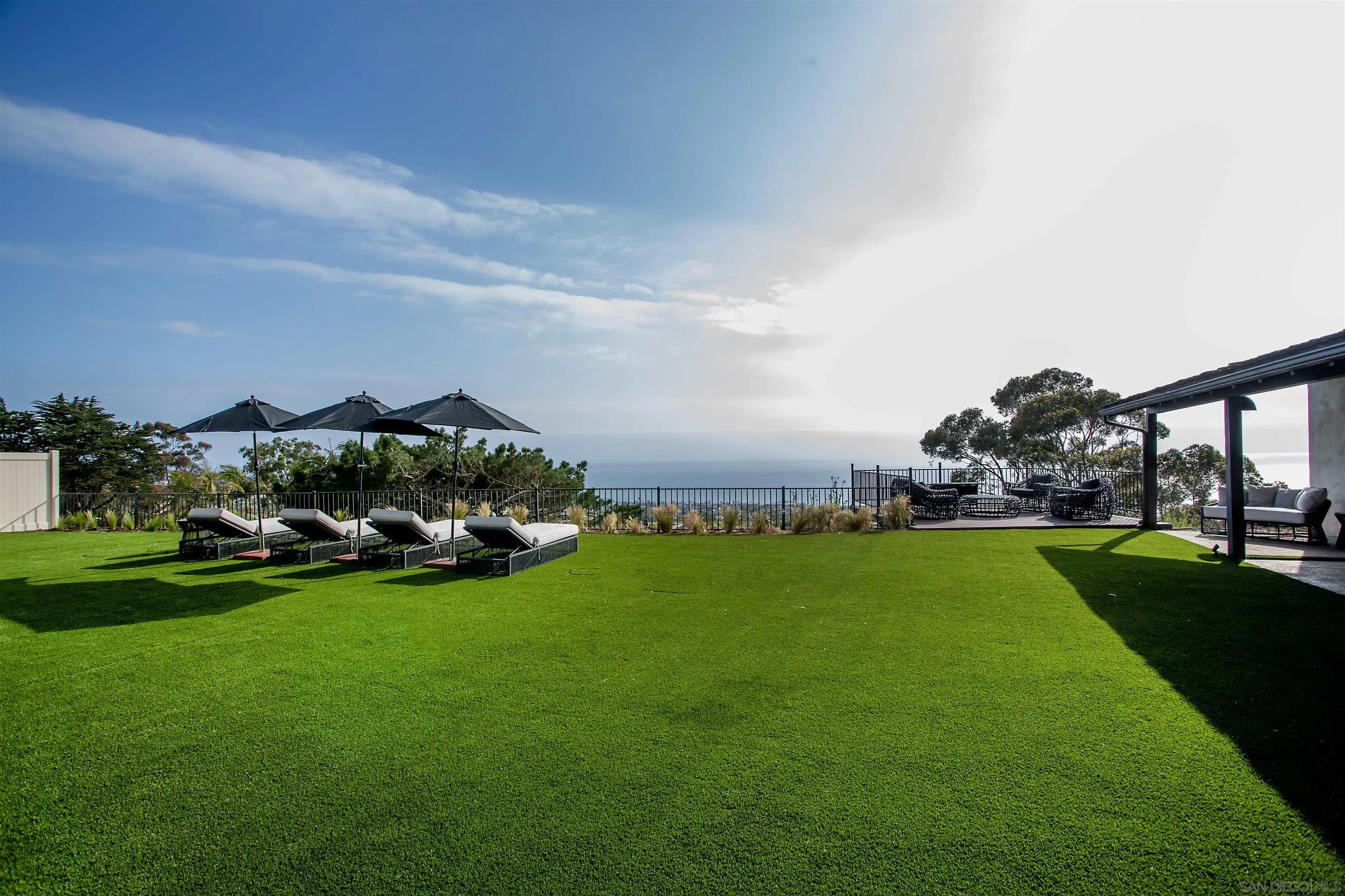 7362 Brodiaea Way La Jolla, CA 92037 - Photo 3 of 31 a view of a field of grass and covered with green space
