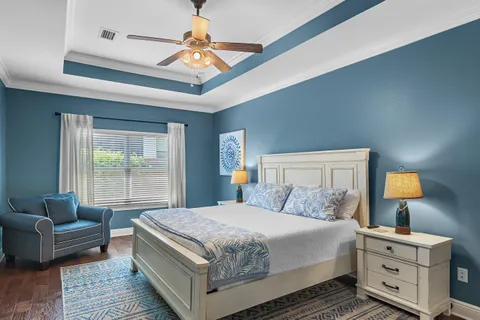 a bedroom with a bed and a couch