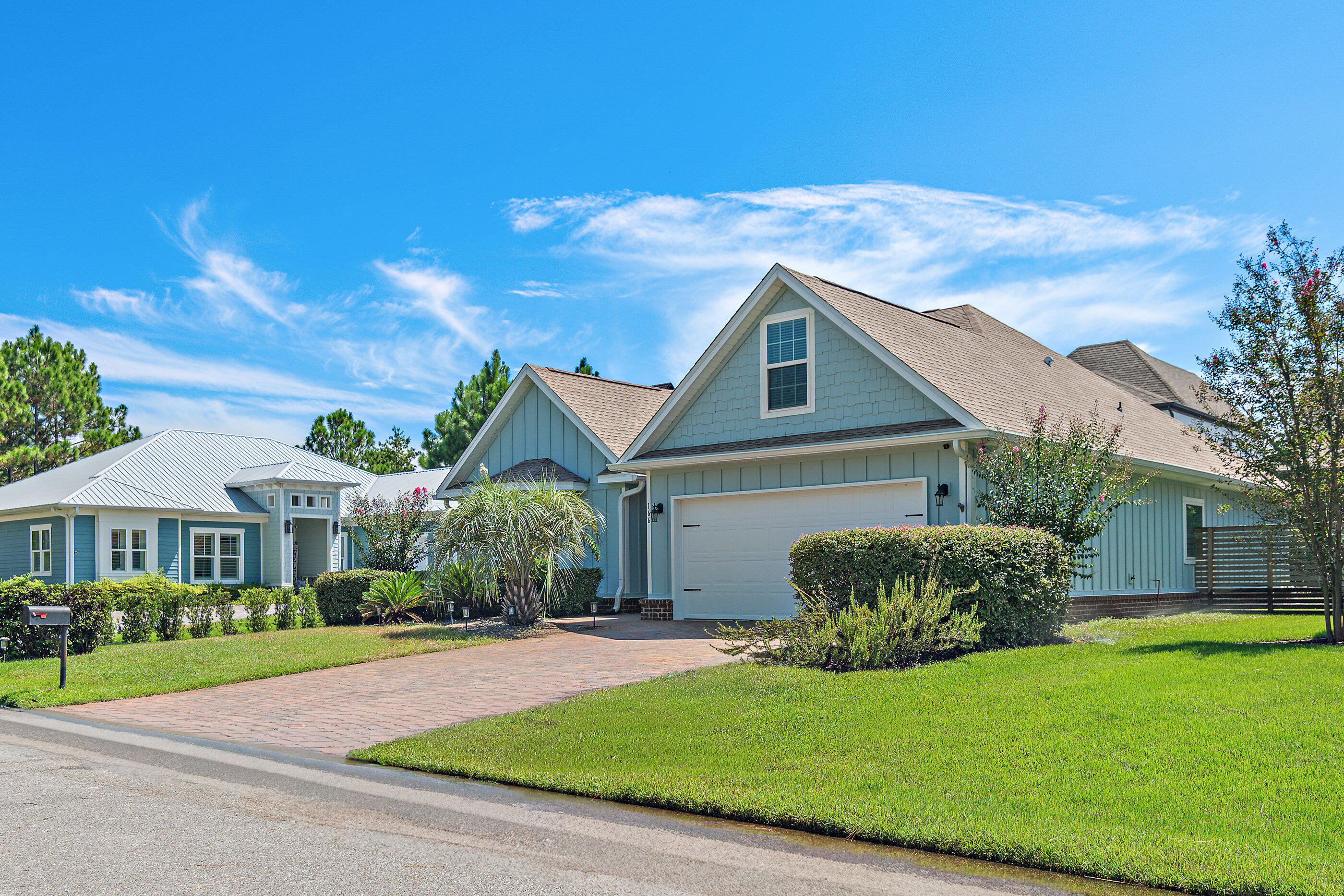 166 Ocean Spray Circle Santa Rosa Beach, FL 32459 - Photo 2 of 31 a front view of a house with a yard