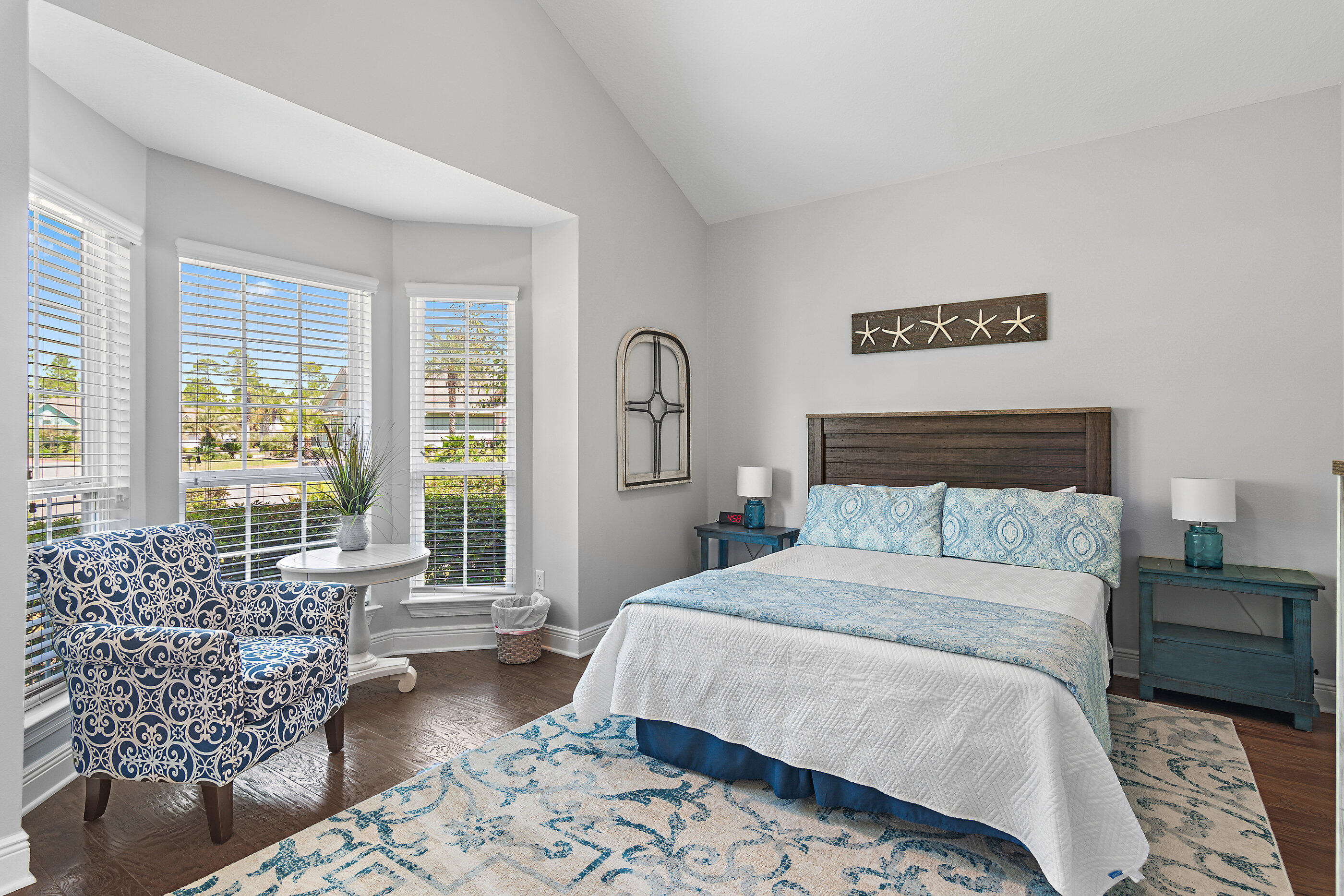 166 Ocean Spray Circle Santa Rosa Beach, FL 32459 - Photo 23 of 31 a bedroom with a large bed couch and a large window