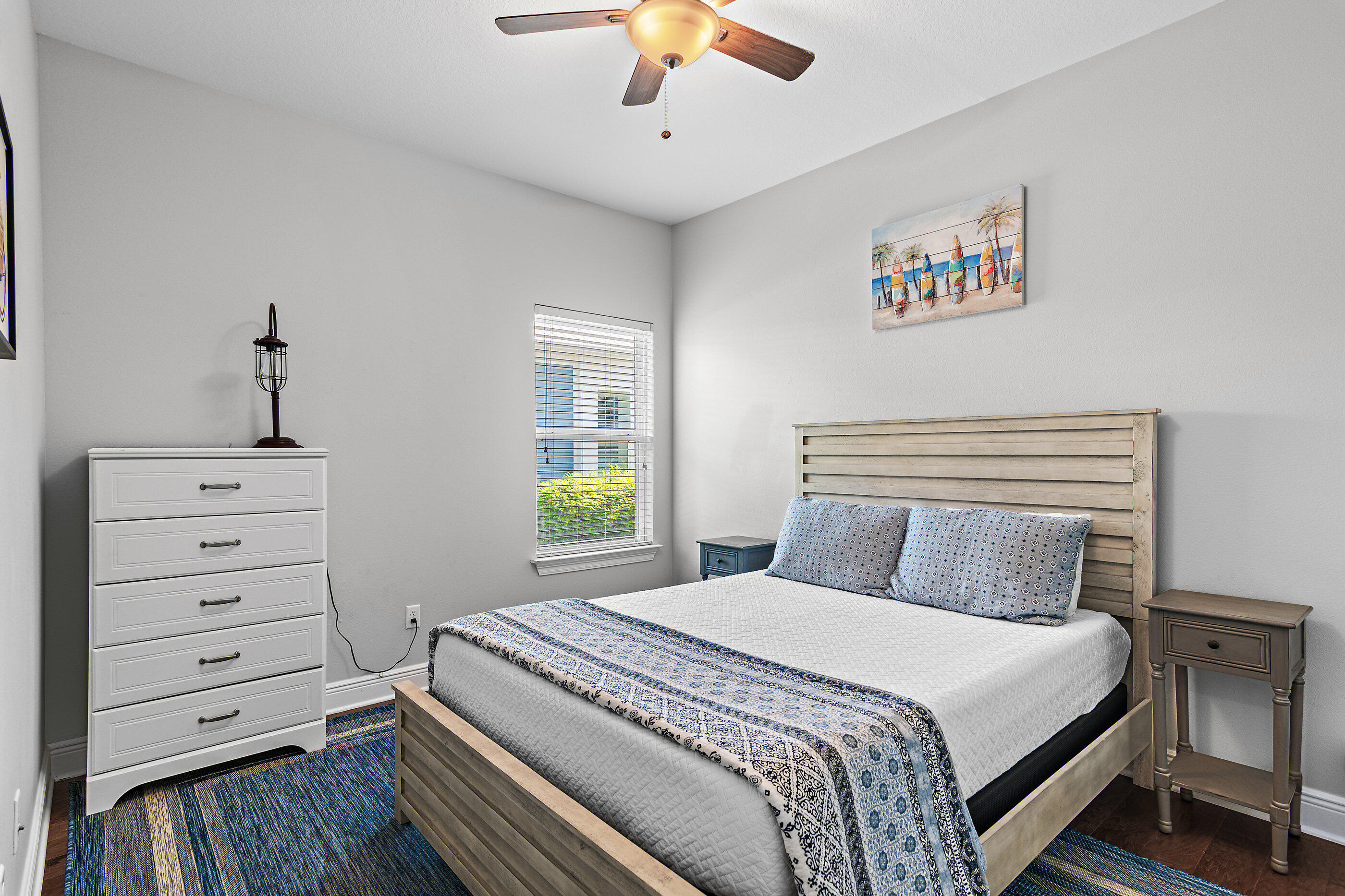 166 Ocean Spray Circle Santa Rosa Beach, FL 32459 - Photo 26 of 31 a bedroom with a bed and a chandelier