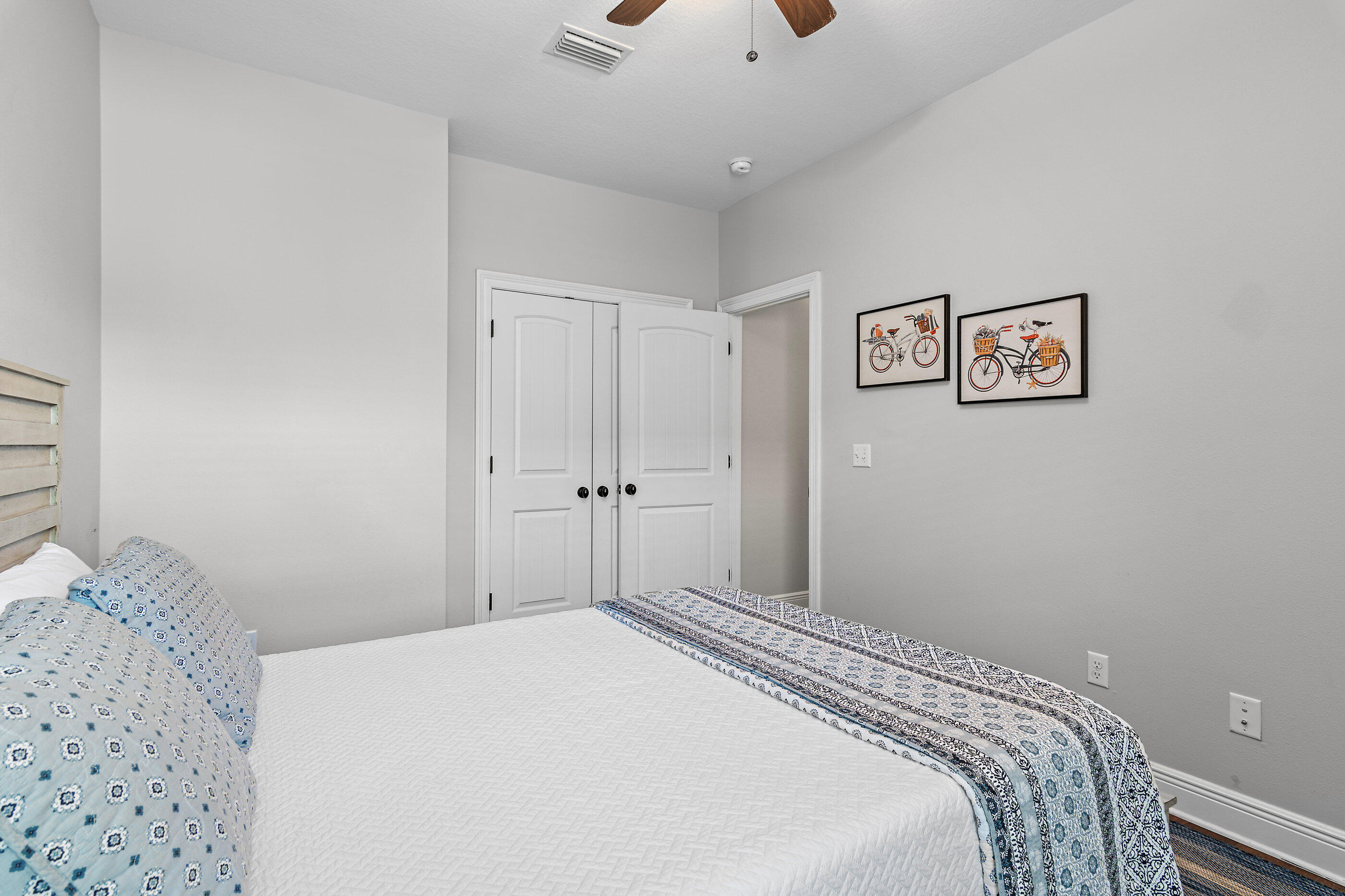 166 Ocean Spray Circle Santa Rosa Beach, FL 32459 - Photo 27 of 31 a bedroom with a bed and a cabinets