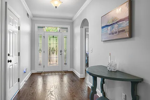 a view of a room with furniture and window