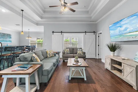 a living room with furniture and a flat screen tv