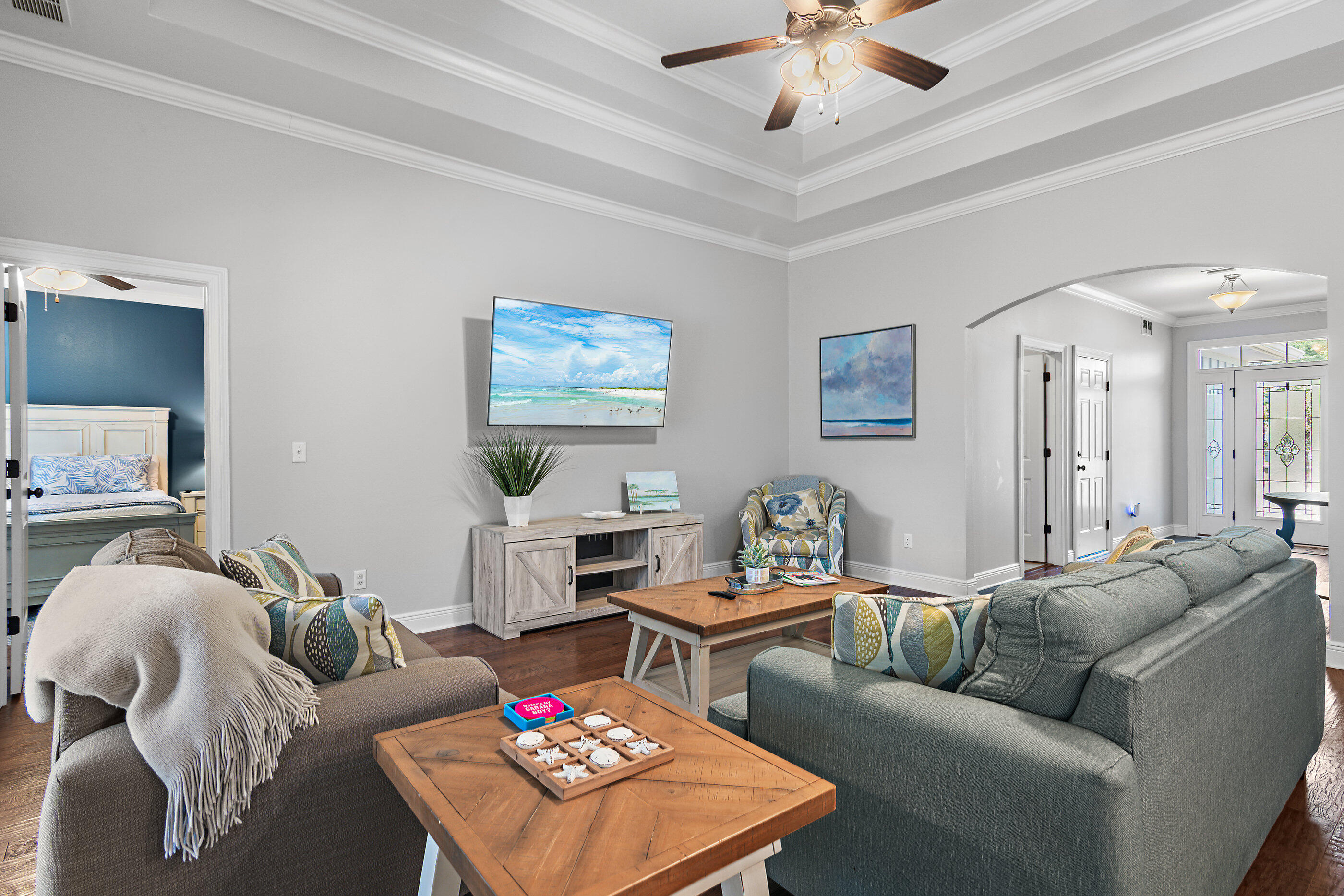 166 Ocean Spray Circle Santa Rosa Beach, FL 32459 - Photo 6 of 31 a living room with furniture a rug and a ceiling fan