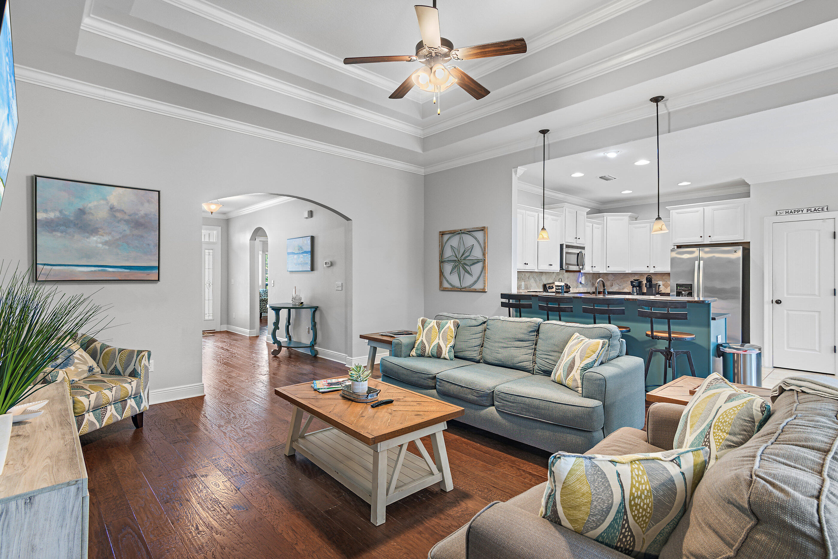 166 Ocean Spray Circle Santa Rosa Beach, FL 32459 - Photo 7 of 31 a living room with furniture kitchen view and a chandelier