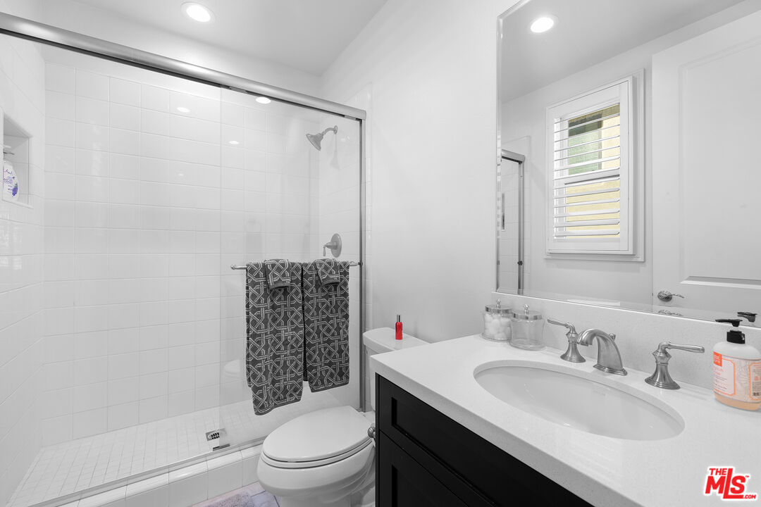 20234 Jubilee Way Porter Ranch, CA 91326 - Photo 27 of 30 a bathroom with a sink toilet and shower