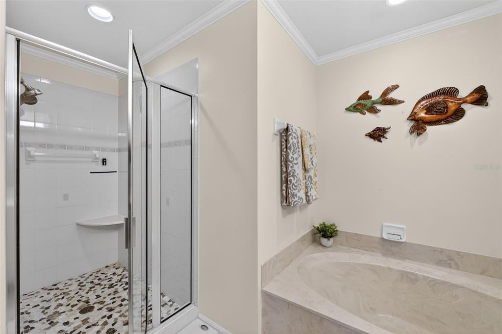 2060 Matecumbe Key Road, Unit 2506 Punta Gorda, FL 33955 - Photo 20 of 38 a bathroom with a granite countertop sink a mirror and shower