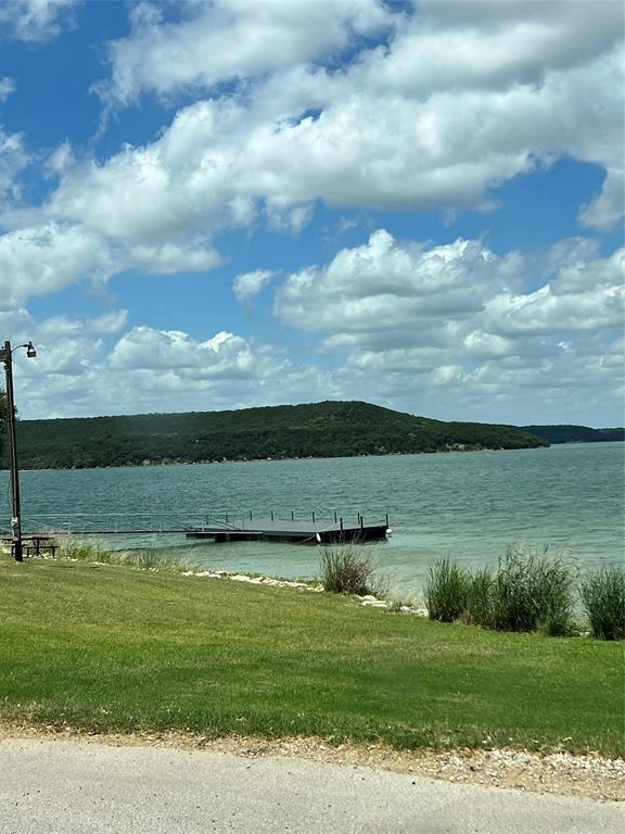 2334 San Bar Road, Unit 46 Graford, TX 76449 - Photo 33 of 37 a view of a lake with a yard