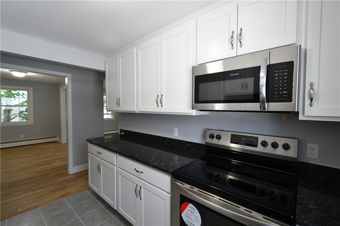 70 Sterling Street Pawtucket, RI 02860 - Photo 4 of 14 New Kitchen Cabinets, Granite Countertops and Stainless Steel Appliances.