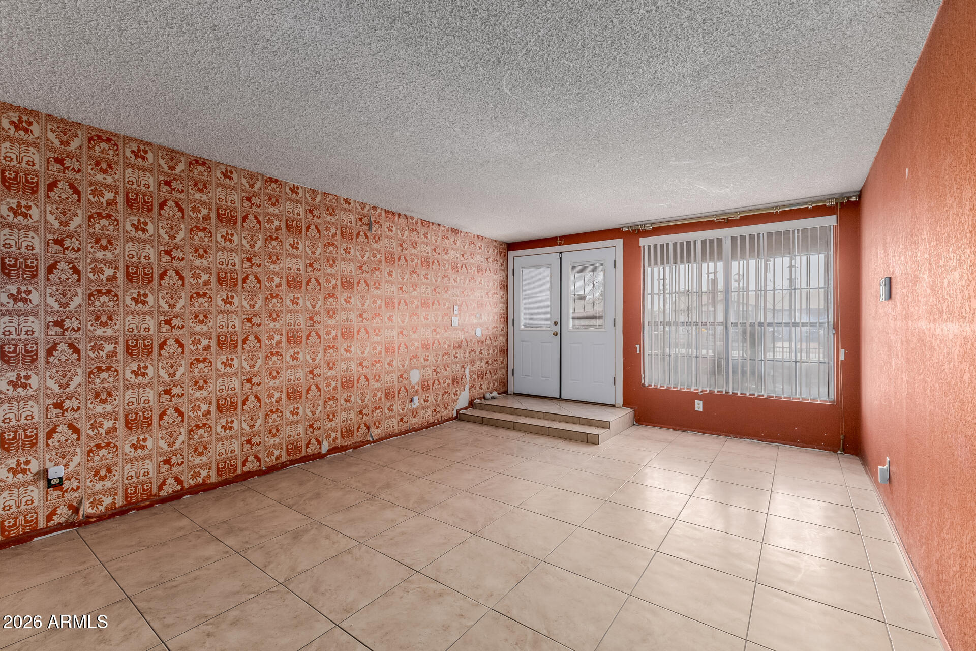 7708 West Flower Street Phoenix, AZ 85033 - Photo 11 of 35 a view of an empty room with a window