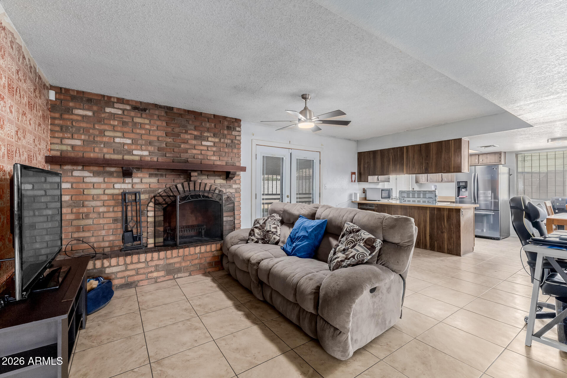 7708 West Flower Street Phoenix, AZ 85033 - Photo 12 of 35 a living room with furniture and a fireplace