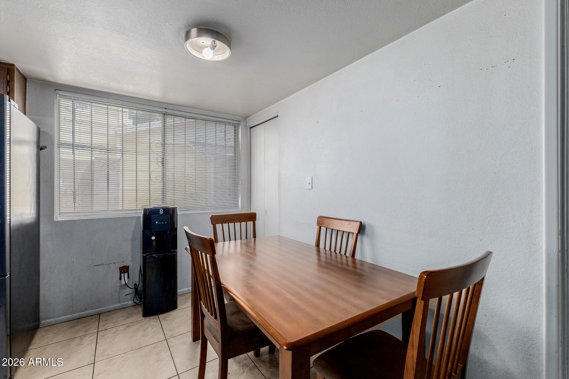 7708 West Flower Street Phoenix, AZ 85033 - Photo 16 of 35 a view of a room with furniture and window