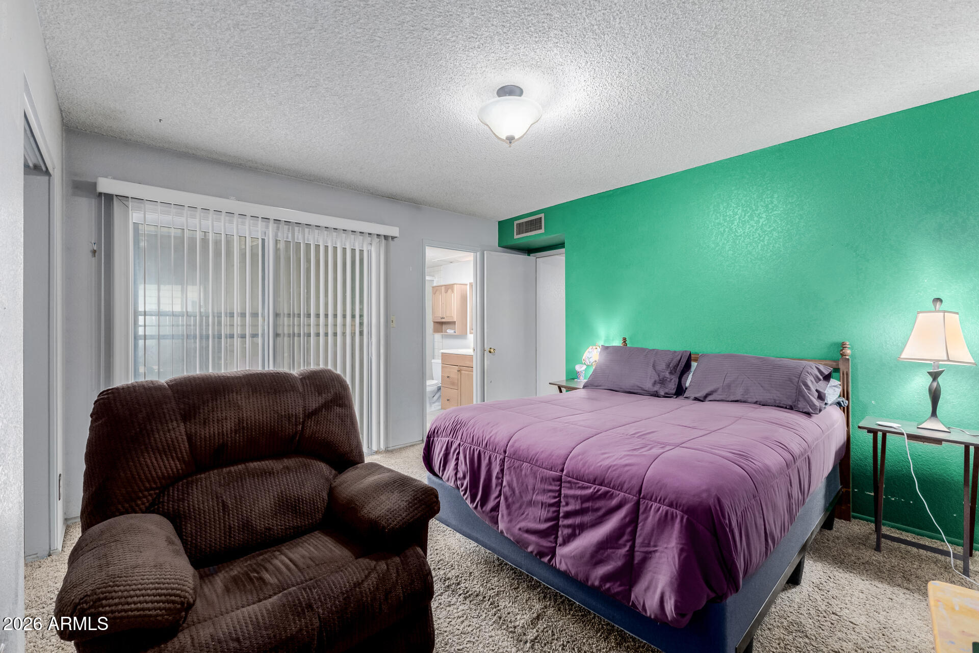 7708 West Flower Street Phoenix, AZ 85033 - Photo 21 of 35 a bedroom with a bed couch and a window