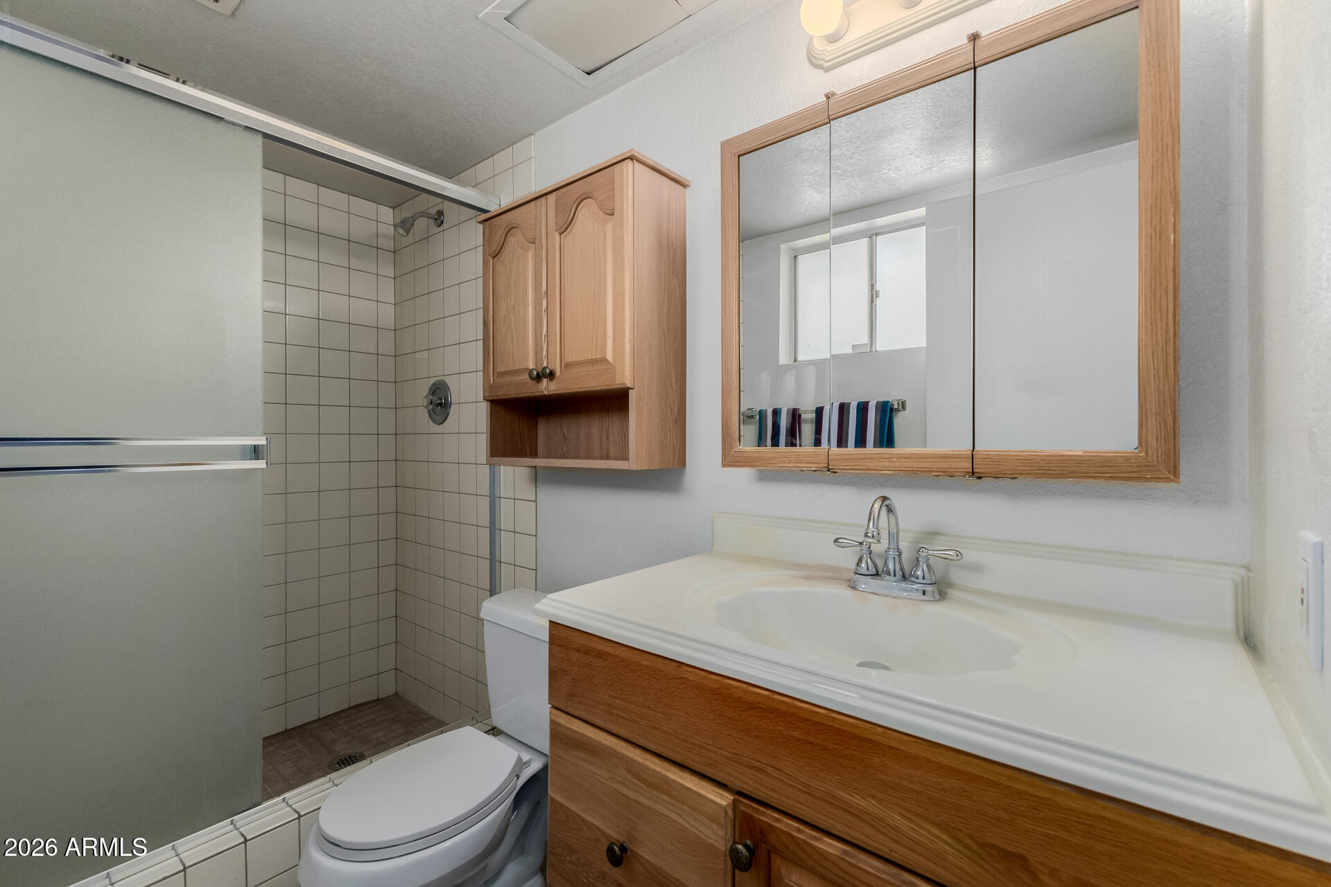 7708 West Flower Street Phoenix, AZ 85033 - Photo 23 of 35 a bathroom with a sink a toilet and shower
