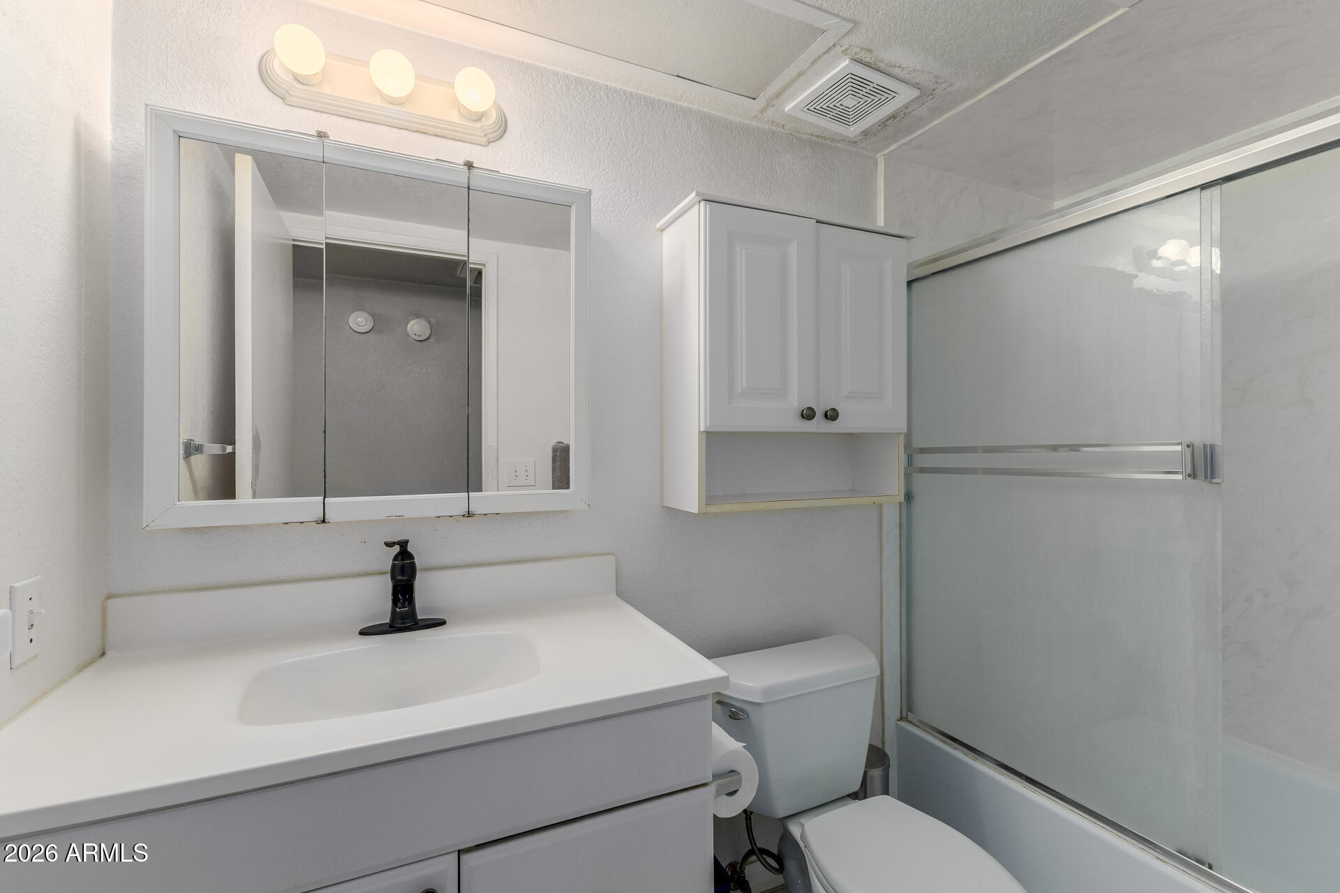 7708 West Flower Street Phoenix, AZ 85033 - Photo 26 of 35 a bathroom with a sink a toilet and shower