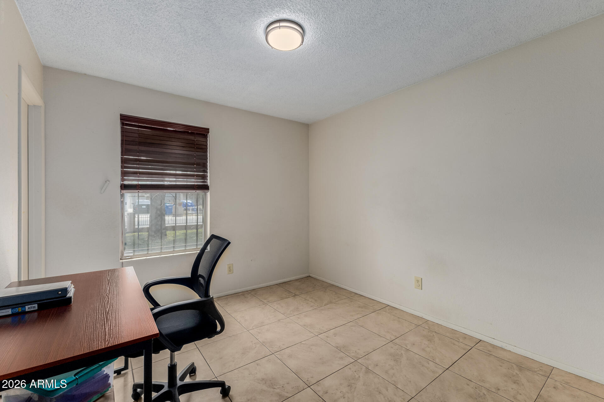 7708 West Flower Street Phoenix, AZ 85033 - Photo 27 of 35 a view of workspace with furniture and window