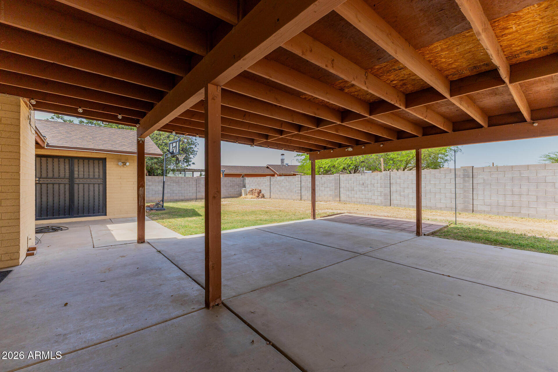 7708 West Flower Street Phoenix, AZ 85033 - Photo 31 of 35 a view of porch with a backyard