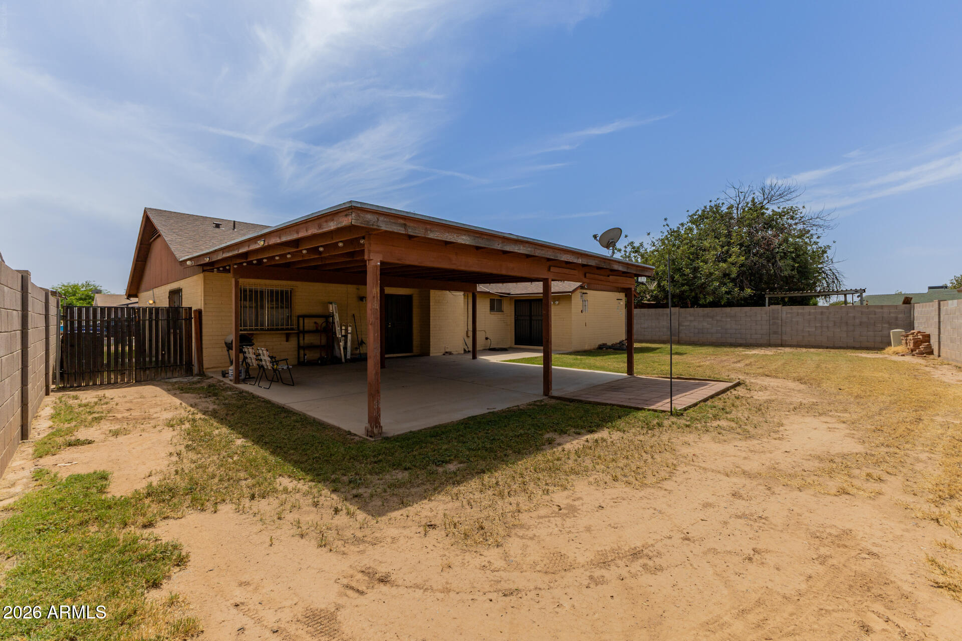7708 West Flower Street Phoenix, AZ 85033 - Photo 33 of 35 a view of a house with a yard