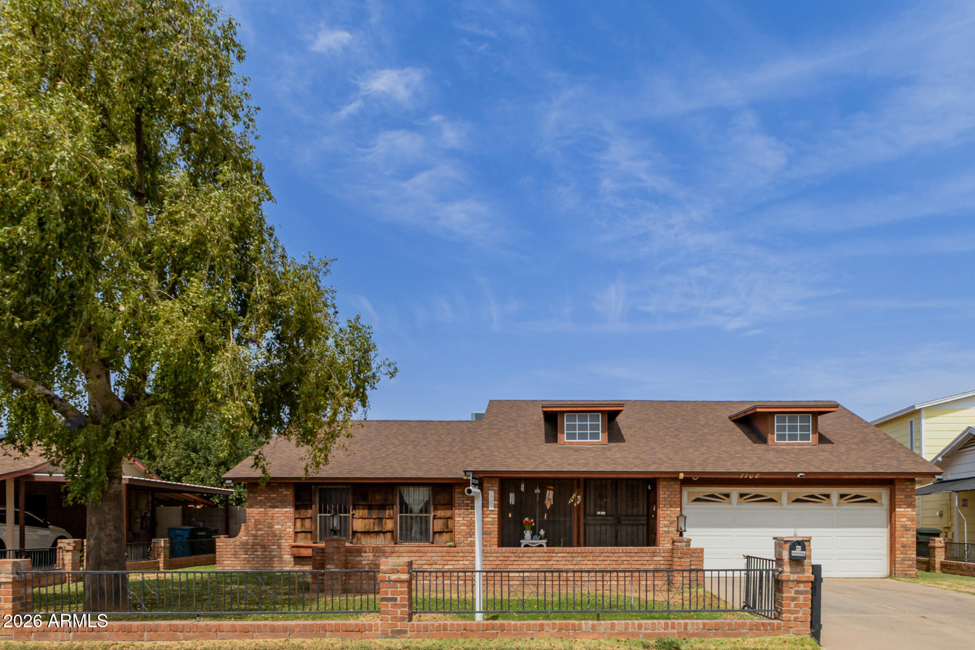 7708 West Flower Street Phoenix, AZ 85033 - Photo 4 of 35 a front view of a building with garden