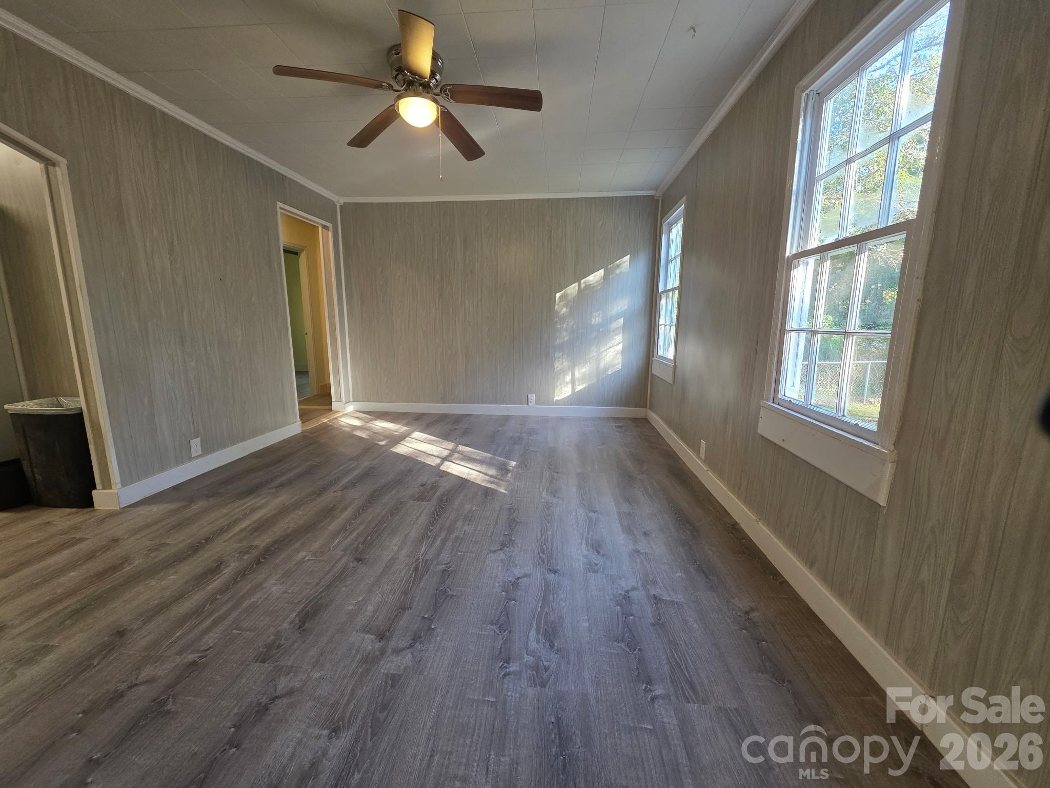 4723 Linden Street Columbia, SC 29203 - Photo 6 of 8 a view of empty room with wooden floor and fan