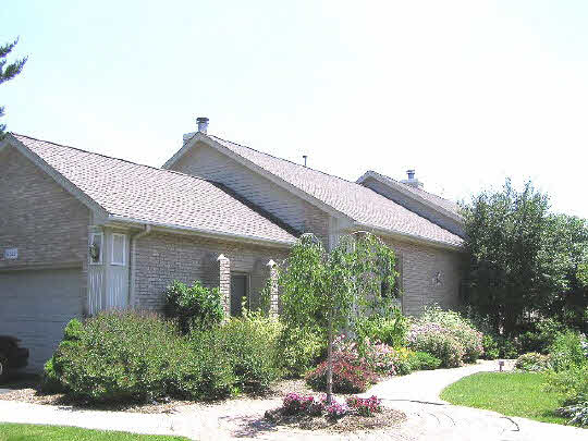 6383 Spring Brook Road Rockford, IL 61114 - Photo 1 of 6 front view of a house with a yard