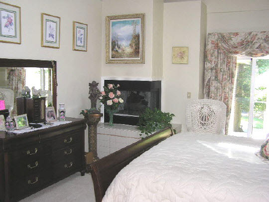 6383 Spring Brook Road Rockford, IL 61114 - Photo 6 of 6 a bedroom with a bed mirror and window