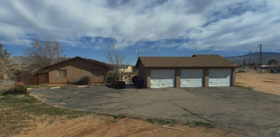 21236 Multnomah Road Apple Valley, CA 92308 - Photo 1 of 1 a view of a house with a yard