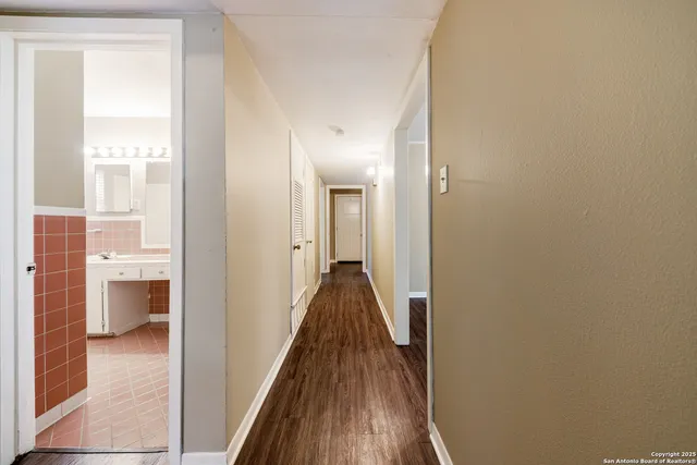 a view of a bathroom from the hallway