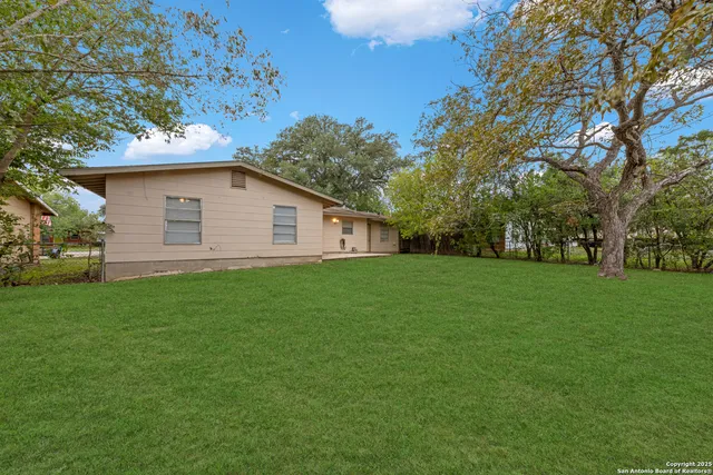 a view of a yard with a house and garden
