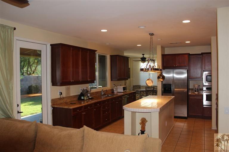 83317 Wagon Road Indio, CA 92203 - Photo 4 of 17 a kitchen with a sink cabinets and stainless steel appliances