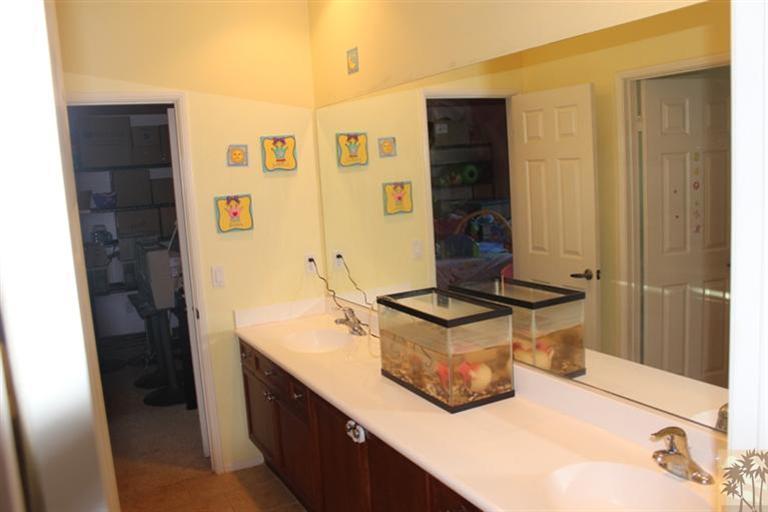 83317 Wagon Road Indio, CA 92203 - Photo 8 of 17 a bathroom with a sink and a mirror