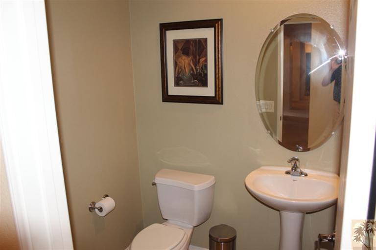 83317 Wagon Road Indio, CA 92203 - Photo 10 of 17 a bathroom with a toilet sink and mirror