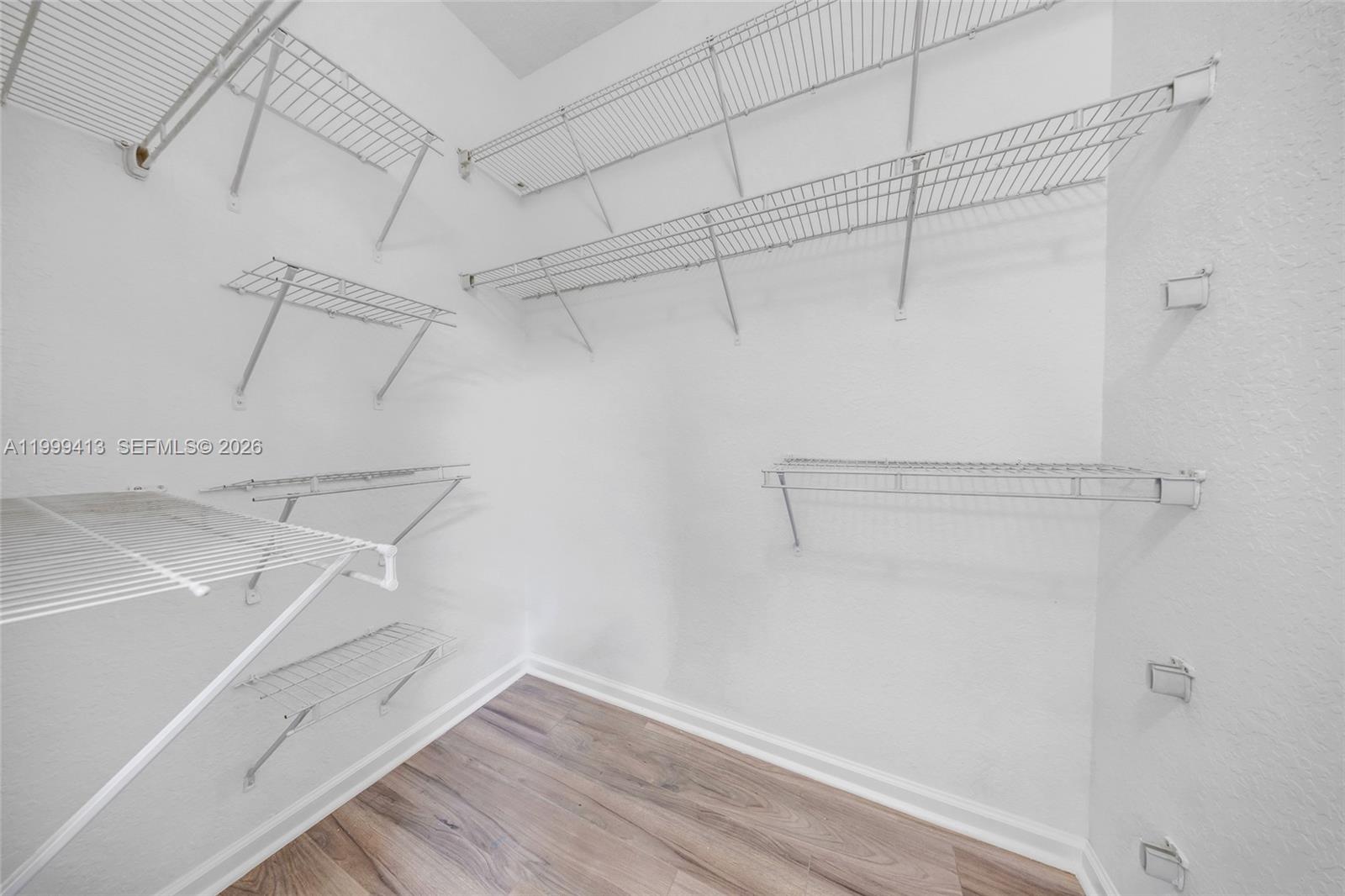 12040 Southwest 28th Street, Unit 4064 Miramar, FL 33025 - Photo 16 of 23 a view of a room with racks on the wall