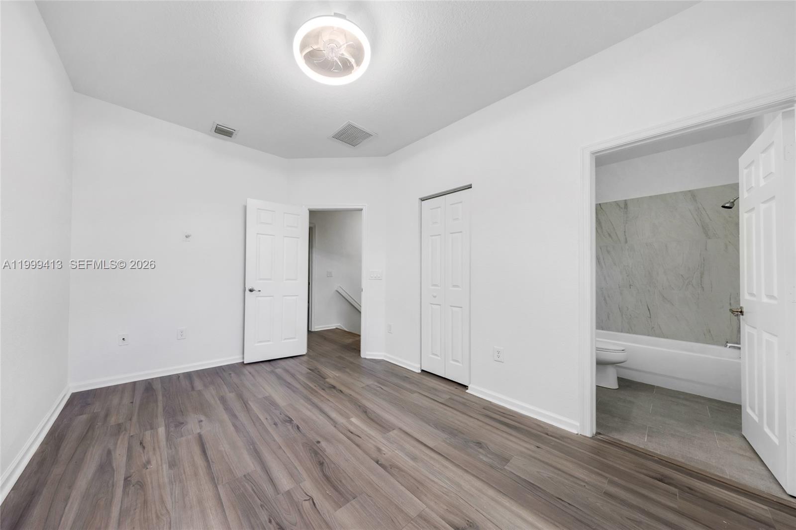 12040 Southwest 28th Street, Unit 4064 Miramar, FL 33025 - Photo 19 of 23 a view of a room with wooden floor