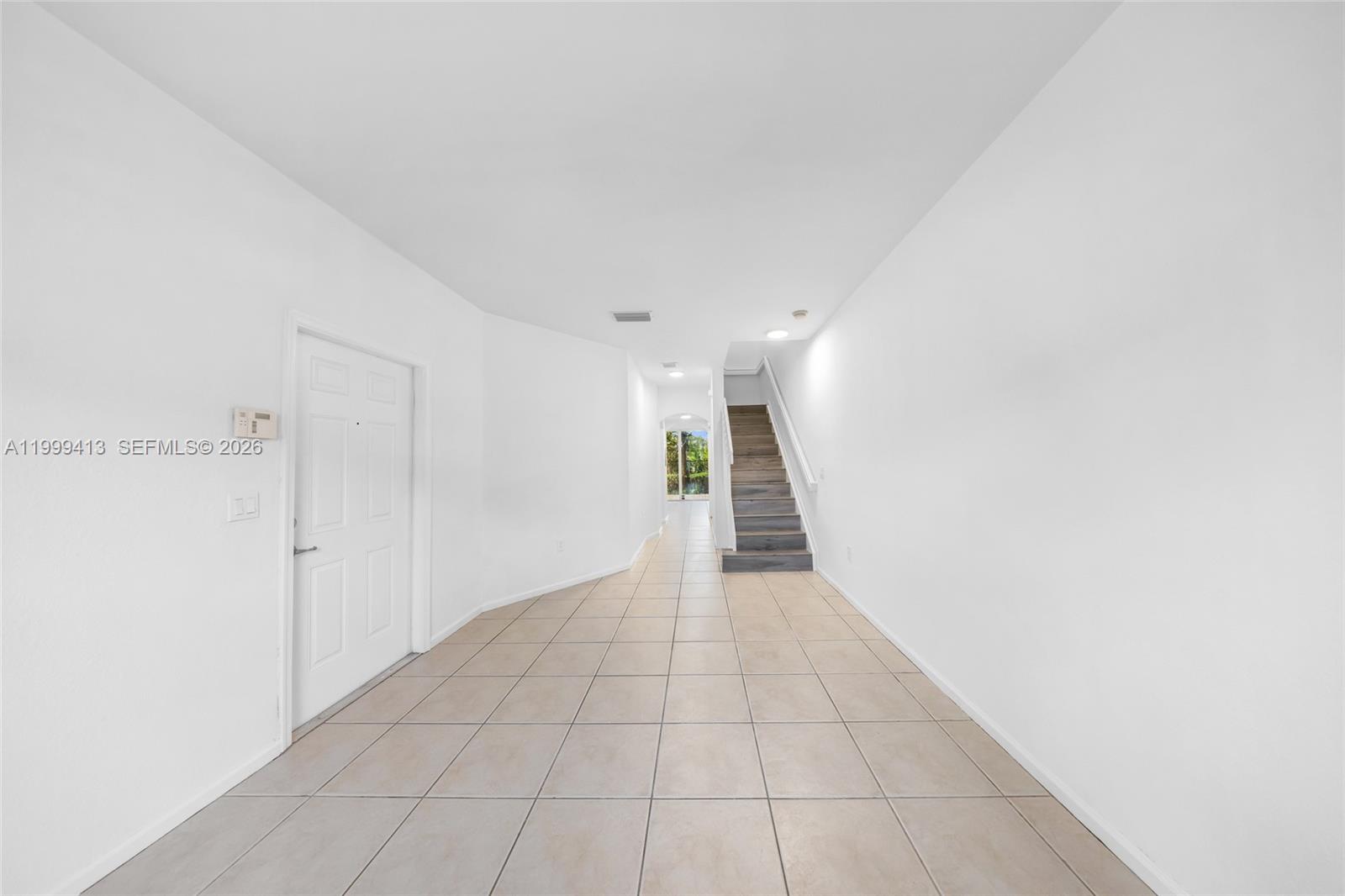 12040 Southwest 28th Street, Unit 4064 Miramar, FL 33025 - Photo 7 of 23 a view of hallway with stairs